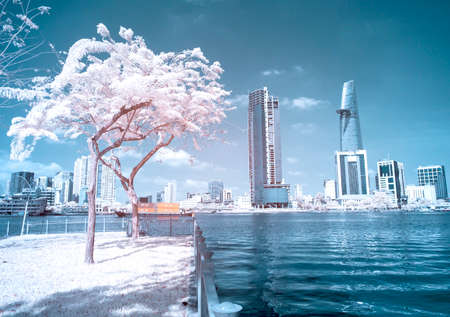 The author takes pictures at the river bank of district two (Ho Chi Minh City). The author takes a photo shoot on the evening 18/3/2021. The content shows the buildings that reflect the Saigon River.の写真素材