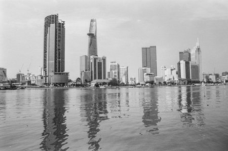 Black and white landscape photo: View of buildings located on the Saigon River. Time: Wednesday morning, December  15, 2021. Location: Ho Chi Minh city.のeditorial素材