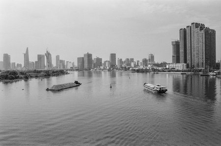 Black and white landscape photo: View of buildings located on the Saigon River. Time: Wednesday morning, December  15, 2021. Location: Ho Chi Minh city.のeditorial素材