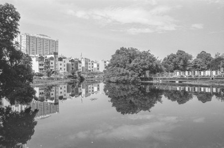 Black and white landscape photo: View of buildings located on the Saigon River. Time: Wednesday morning, December  15, 2021. Location: Ho Chi Minh city.のeditorial素材