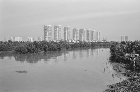 Black and white landscape photo: View of buildings located on the Saigon River. Time: Wednesday morning, December  15, 2021. Location: Ho Chi Minh city.のeditorial素材