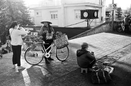 Black and white landscape photo film: street life in DaLat city. Time: March 5, 2022. Location: DaLat city.  Da Lat is a famous tourist city in Vietnamのeditorial素材