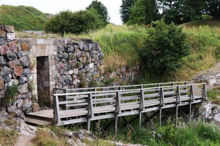 small wooden bridge and stone brick wallの写真素材