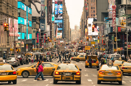 NEW YORK - DECEMBER 22, 2013  rush hour with cabs and melting pot people on 7th av  in Manhattan before sunset  Seventh Avenue is southbound below Central Park and a two-way street north of the park のeditorial素材