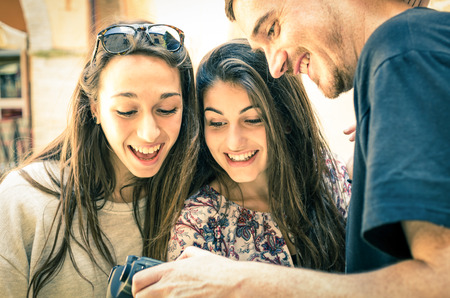 Handsome Boy shows Pictures to beautiful Girls