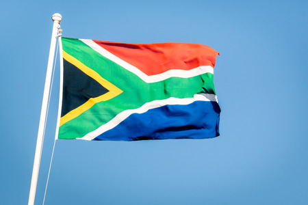 South african flag on a blue sky - Pride of the nation South Africa adopted on 27 April 1994 representing the new democracyの写真素材
