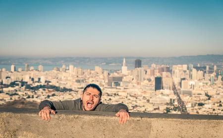 Young man committing suicide at the edge of San Francisco Twin Peaksの写真素材