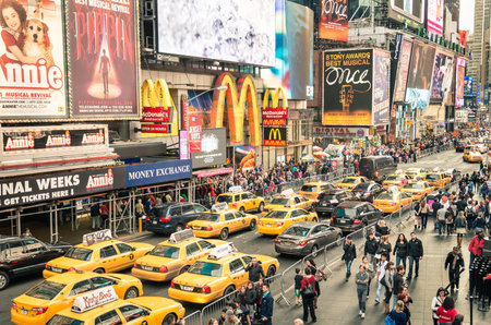 NEW YORK - DECEMBER 22, 2014: taxicabs and traffic jam congestion in front of Mc Donalds in Times...