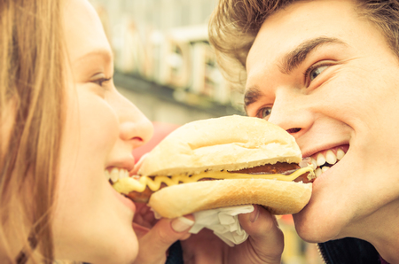 Couple in Love sharing an Hot Dogの写真素材