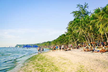 BORACAY, PHILIPPINES - 13 FEBRUARY 2016: tourists and everyday life in Boracay - Exclusive destination islands in Philippines - Travel concept with white sand beach and blue ocean in south east Asiaのeditorial素材