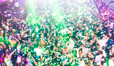 Blurred defocused background of concert festival event with dj playing after party music -...