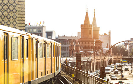 BERLIN, GERMANY - 14 OCTOBER 2016: yellow train of Berliner U-Bahn with Oberbaum Bridge on background at Friedrichshain Kreuzberg near Warschauer Strasse subway stationのeditorial素材