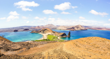Panoramic view of Isla Bartolome at Galapagos Islands archipelago - Travel and wanderlust concept exploring world nature wonders around Ecuador - Vivid filter with warm bright color tonesの写真素材