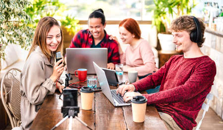 Happy people sharing content on streaming platforms with digital web cam - Modern life style concept with guys and girls speaking and having fun vlogging live feeds interviewの写真素材