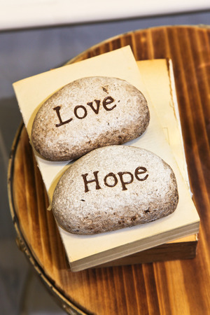 Love and Hope engraved on stonesの写真素材