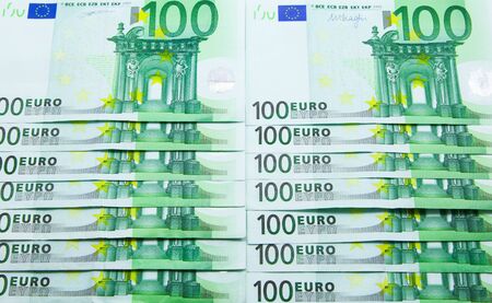 Pile of 100 Euro banknotes background