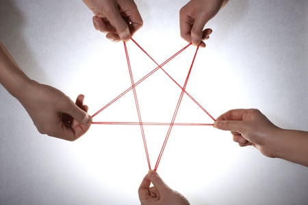People playing cats cradle game