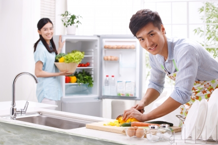 Young couple in kitchenの写真素材