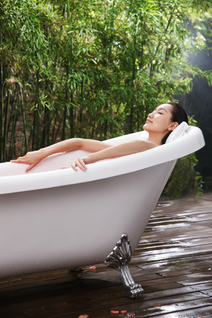 Young woman bathingの写真素材