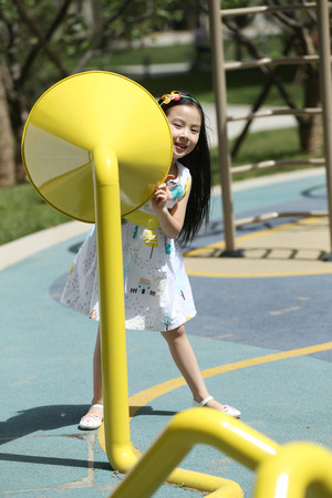 The little girl was playing outdoorsの写真素材