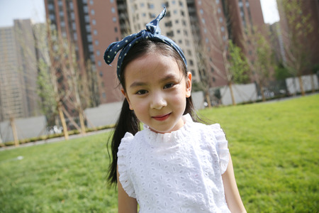 The little girl was playing outdoors