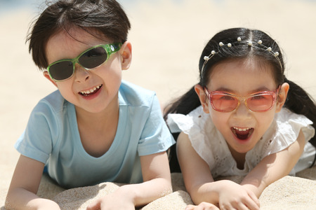 Children play sand outdoorsの写真素材