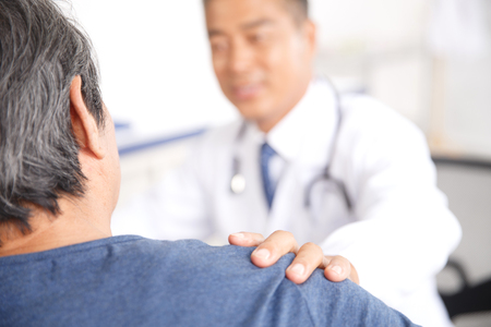 The doctor to the diagnosis and treatment in patientsの写真素材