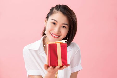 Young woman with a gift box
