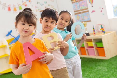 Kindergarten children in learning Englishの写真素材