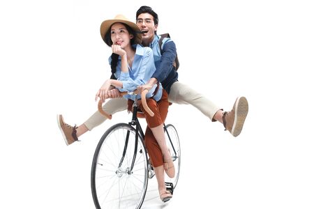 Young lovers ride bikesの写真素材