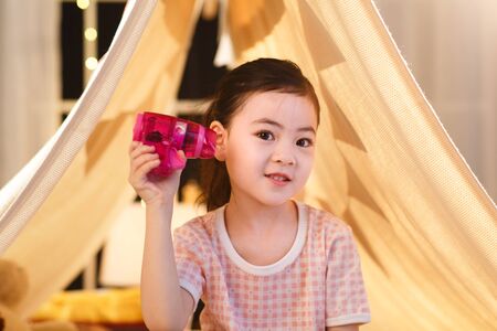 Cute little girl with toyの写真素材