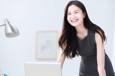 Business women smiling in officeの写真素材
