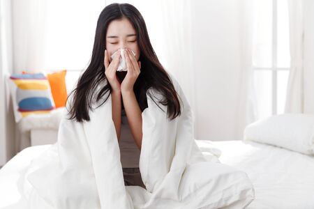 Young woman suffering from fluの写真素材