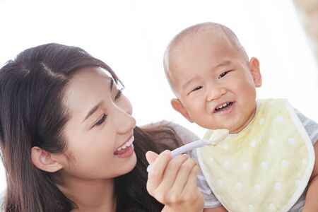 Mother feed the babyの写真素材