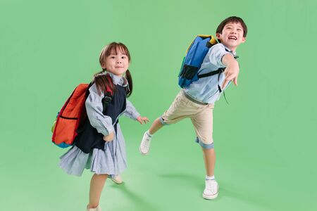 The little boy and little girl throw paper airplanesの写真素材