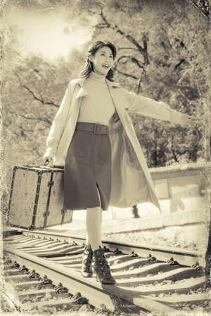 Young women walk on the trackの写真素材