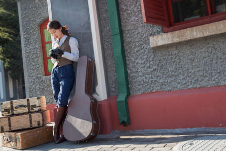 Young woman standing on the platform at the railway station