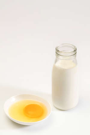 A glass of milk and eggsの写真素材
