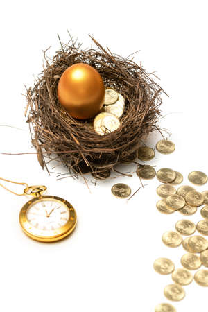 Gold COINS in the bird's nest eggs and pocket watchの写真素材