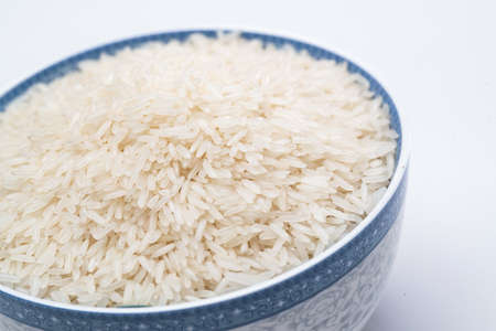 A bowl of long grain fragrant riceの写真素材