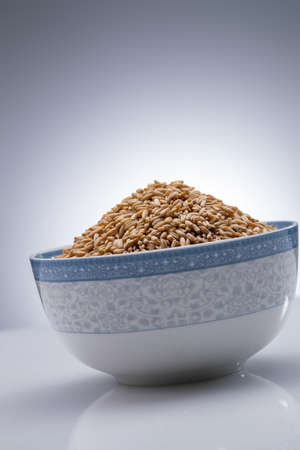 A bowl of oatmeal m gray backgroundの写真素材
