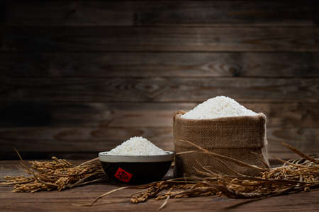 A bowl of rice and a bag of riceの写真素材