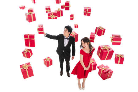 Happy young couples holding the gift boxの写真素材