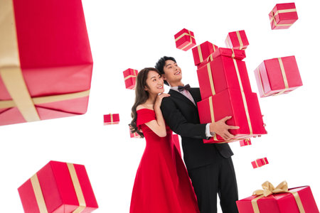 Happy young couples holding the gift boxの写真素材