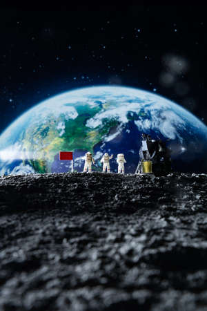 Miniature people : Astronaut and astronaut on planet earth.の写真素材