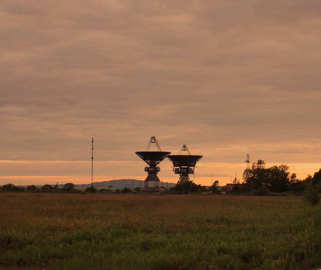 Locator of an outer-space communication against a sunsetの写真素材