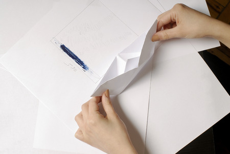 girl crafted paper boatの写真素材