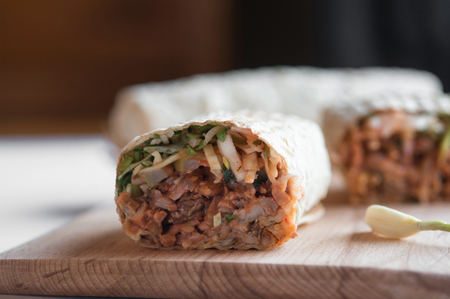 Traditional oriental sandwich with meat, onion and herbsの写真素材