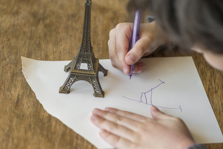the child is drawing with penの写真素材