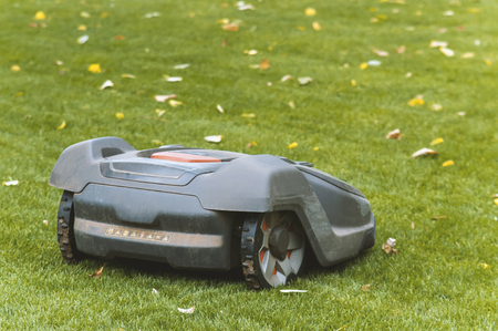 Lawnmower robot, automatic lawn mower that mows the lawn in a gardenの写真素材